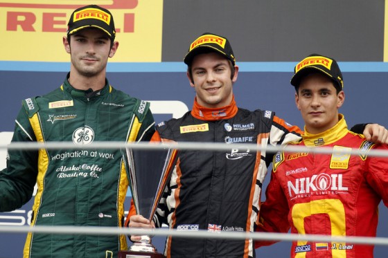 2013 GP2 Series. Round 9. Autodromo di Monza, Monza, Italy. 8th September. Sunday Race. Adrian Quaife Hobbs (GBR, Hilmer Motorsport) celebrates his victory on the podium with Alexander Rossi (USA, Caterham Racing) and Julian Leal (COL, Racing Engineerin
