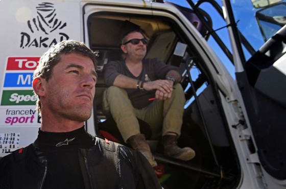 Dakar Rally director Etienne Lavigne (R) and KTM's Spanish biker Marc Coma gesture before the start of the Stage 4 of the Dakar 2015 between Chilecito, in Argentina and Copiapo, Chile, on January 7, 2015. AFP PHOTO / FRANCK FIFE