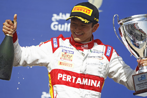 2015 GP2 Series Round 1 - Bahrain International Circuit, Bahrain. Sunday 19 April 2015. Rio Haryanto (INA, Campos Racing) celebrates his win on the podium. Photo: Sam Bloxham/GP2 Series Media Service. ref: Digital Image _G7C9003